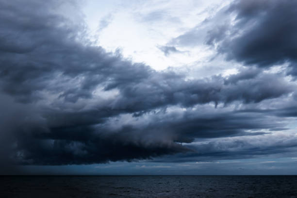 istock Dramatic dark cloudy sky over sea, natural photo background 2148965443