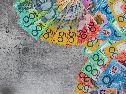 Different denomination Australian dollars AUD currency on desk. Money concept