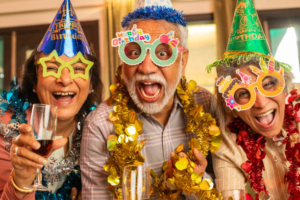 istock Old friends enjoying drinks at house party 2148965808
