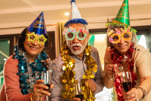 istock Old friends enjoying drinks at house party 2148966132