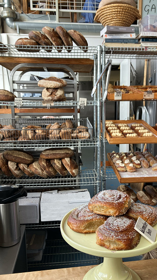 Fresh Pastries on a Bakery Rack Inside a Pastry Shop - Vertical
