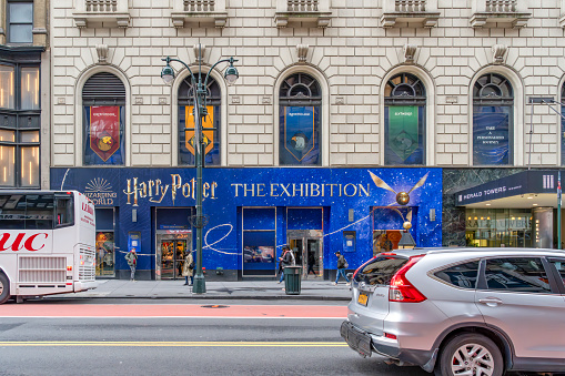 Manhattan, New York, USA - March, 2024.  Harry Potter Exhibition on Broadway with people outside.