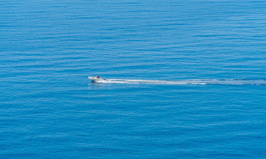 Small fishing boat navigating in open sea Miami Florida