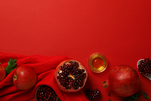 Pomegranate Fruits cut open with seeds on dark background