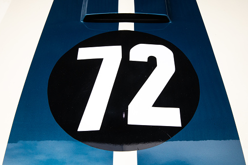 Number 72 on the bonnet of a car.