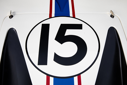 Number 15 on the bonnet of a car.