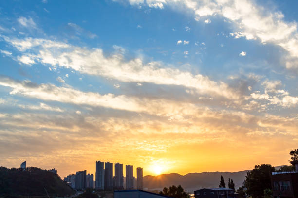 Dramatic golden sunset clouds sky over the South Korea countryside