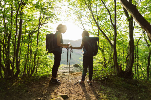 istock Two women taking a break from hiking to admire the view 2148970156