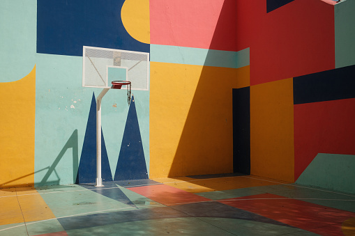 Colourful basketball court. Sunny day. Basketball court in Cordoba, Spain.