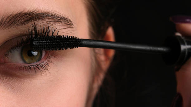 istock Girl Making Makeup Using Black Mascara On Her Long Eyelashes, Close Up View 2148971569