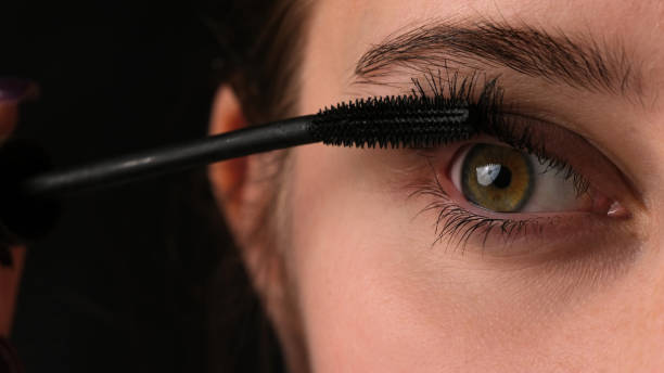 istock Girl Making Makeup Using Black Mascara On Her Long Eyelashes, Close Up View 2148971576