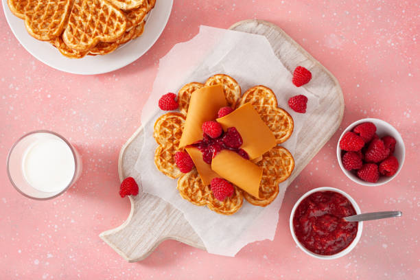 istock waffles with Norwegian brunost traditional brown cheese and raspberry jam 2148974262
