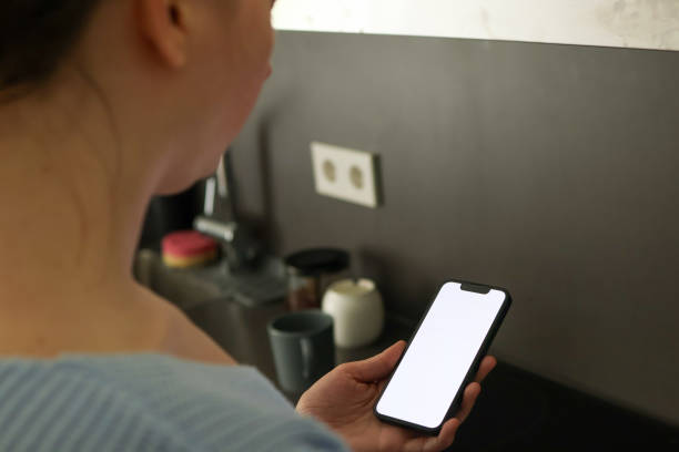 istock a woman staring at her cell phone screen 2148974810