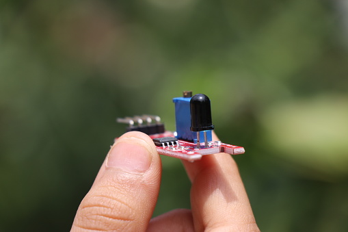 Flame sensor that detects the fire used in making prototype micro controller and breadboard projects held in the hand