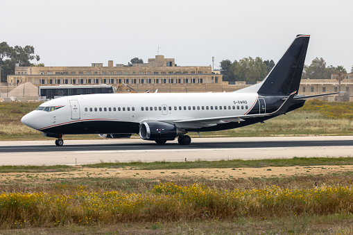 Luqa, Malta - April 15, 2024: 2Excel Aviation Boeing 737-3L9 (REG: G-SWRD) landing as flight BRO21 from London Stansted Airport.