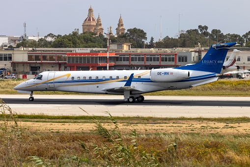 Luqa, Malta - April 15, 2024: Europ-Star Aircraft GmbH Embraer Legacy 600 (EMB-135BJ) (REG: OE-IRK) backtracking after landing runway 13.