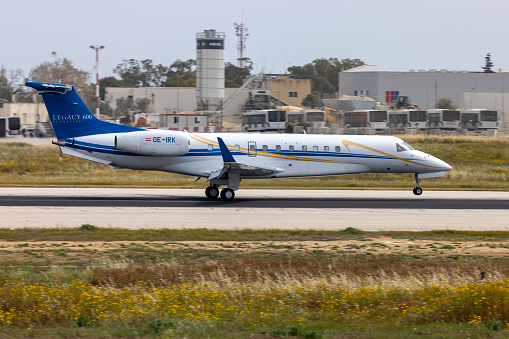 Luqa, Malta - April 15, 2024: Europ-Star Aircraft GmbH Embraer Legacy 600 (EMB-135BJ) (REG: OE-IRK) landing runway 13.