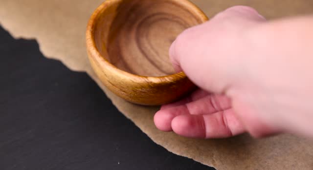 a wooden bowl on the table