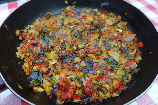 Browned spicy mixed vegetables to make an omelette