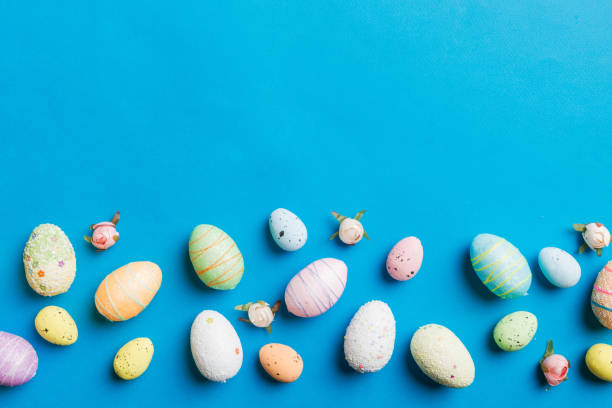 istock Happy Easter concept. Preparation for holiday. Easter eggs on colored background. flat lay top view copy space banner 2148977857