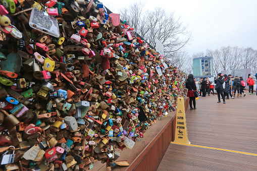 Seoul, South Korea : December28,2014 : People looking at the love locks on the bridge railing at N-Seoul Tower, Namsan Park.