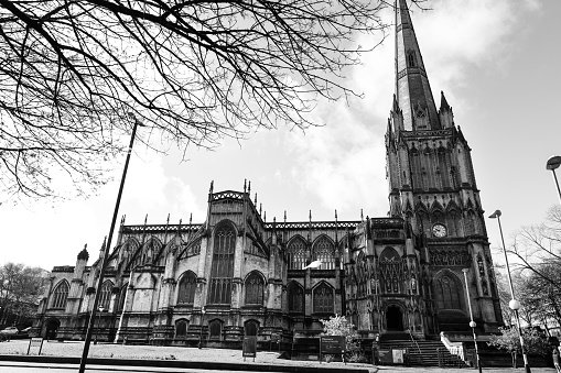Bristol, England- March 29, 2024: Colossal facade of St. Mary Redcliffe Church in Bristol in the morning