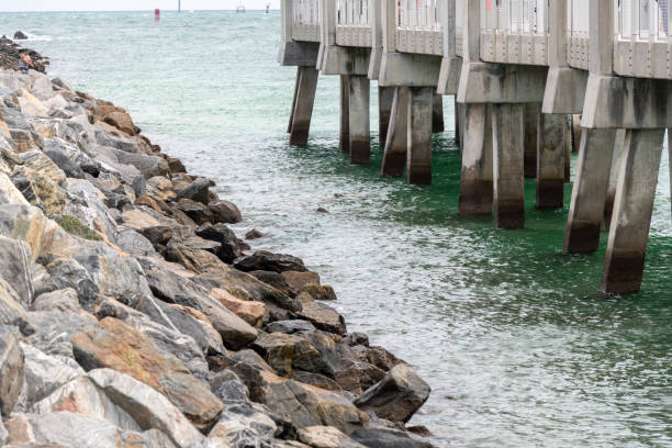 Large rocks on coast and pier in Miami Florida
