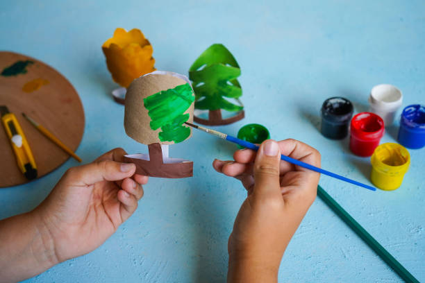 istock Kids craft trees out of recycling toilet paper roll, zero waste concept. Step by step tutorial - 4. 2148980379