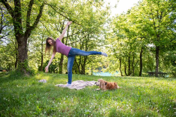 istock Doing yoga outdoors with the dog company 2148980961