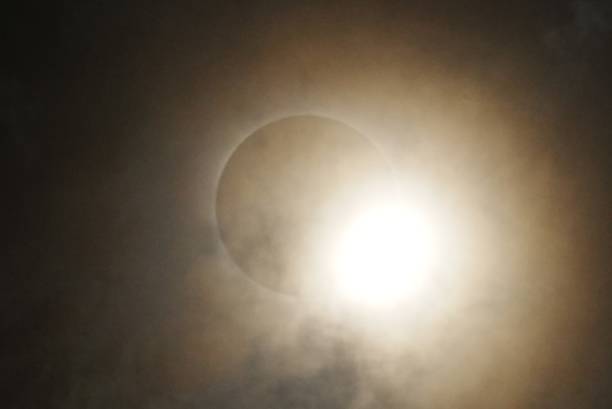 Total Solar Eclipse through swirling clouds and fog at Garner State Park Texas.  Great American Mexican Eclipse GAME 2024