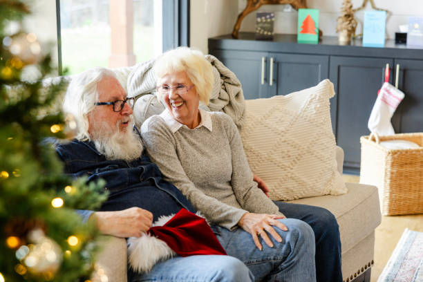 istock After an exciting Christmas day, grandparents relax on sofa 2148981846