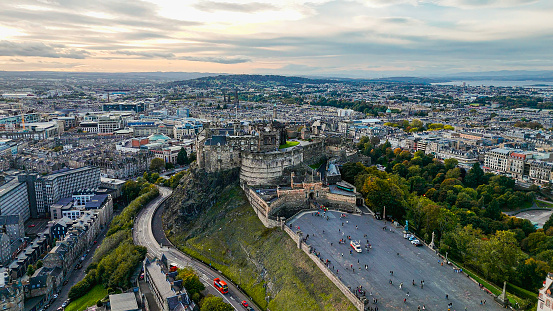 Aerial view of Edinburgh old town, Edinburgh city centre, Gothic Revival architecture in Scotland, Aerial view of Edinburgh Castle\n\nEdinburgh is the capital city of Scotland and one of its 32 council areas. The city is located in south-east Scotland, and is bounded to the north by the Firth of Forth estuary and to the south by the Pentland Hills. Edinburgh had a population of 506,520 in mid-2020, making it the second-most populous city in Scotland and the seventh-most populous in the United Kingdom.