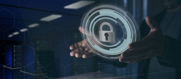 istock Cyber security, protection concept. Man hands holding a virtual padlock. Data center in background 2148982188