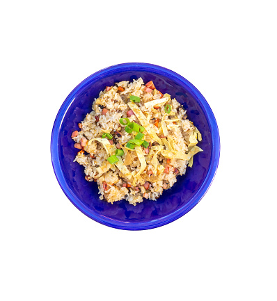 Com chien duong chau, a Vietnamese fried rice on white background. Ingredients are chopped carrot, hams, mushrooms and eggs. Chopped scallion, shallots and garlics are used for aroma purposes.
