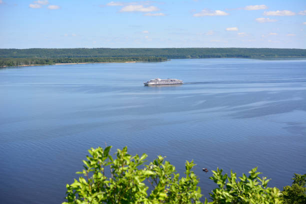 a large white boat is sailing on a river view from the hill