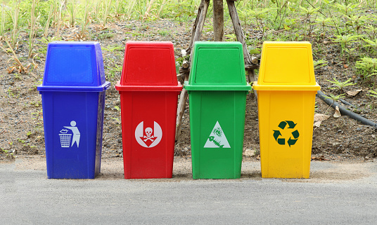 Colorful bins on cement floor