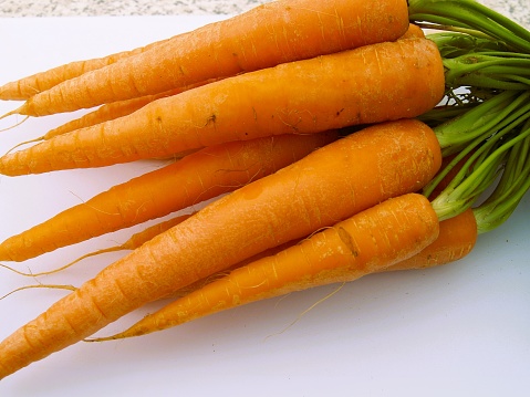 A freshly picked bunch of organic carrotd