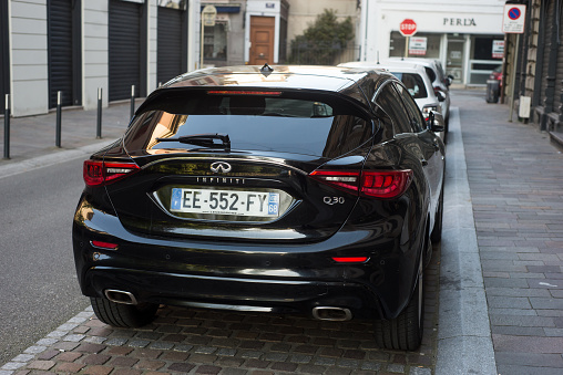 Mulhouse - France - 14 April 2024 - rear view of black infiniti Q30 parked in the street