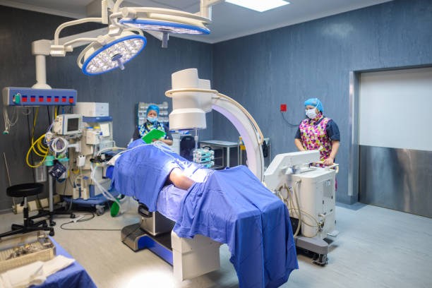 istock Modern Surgical x-ray machine operated by radiologist in operating room 2148987944