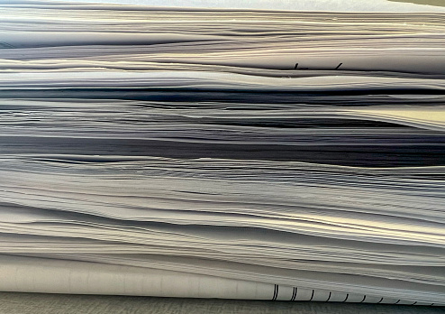 A close-up image of a pile of papers.