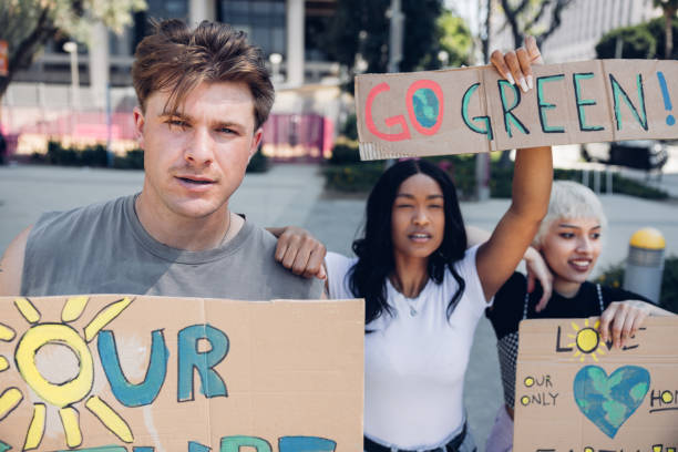 istock Group of climate activists in downtown demonstrate for Earth Day 2148988705