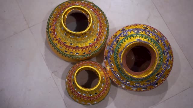 close-up of  clay pots, beautifully decorated for an Asian wedding