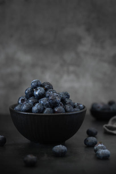 istock A bowl with Blueberries in a Dark Background 2148990209