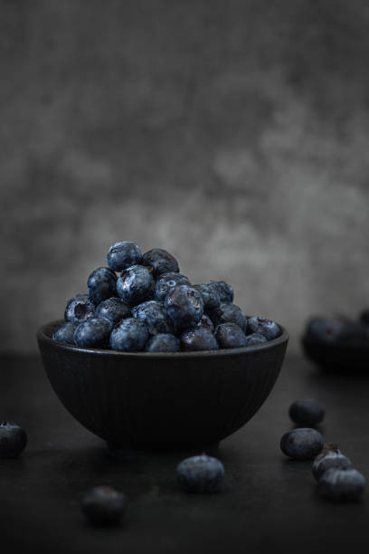 istock A bowl with Blueberries in a Dark Background 2148990211