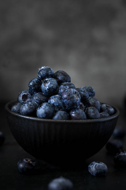 istock A bowl with Blueberries in a Dark Background 2148990213