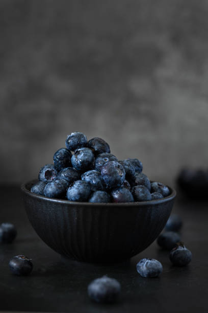 istock A bowl with Blueberries in a Dark Background 2148990214