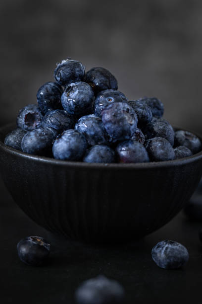 istock A bowl with Blueberries in a Dark Background 2148990216