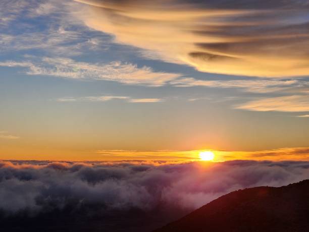 istock Sunset from above the clouds on mountain top 2148990940