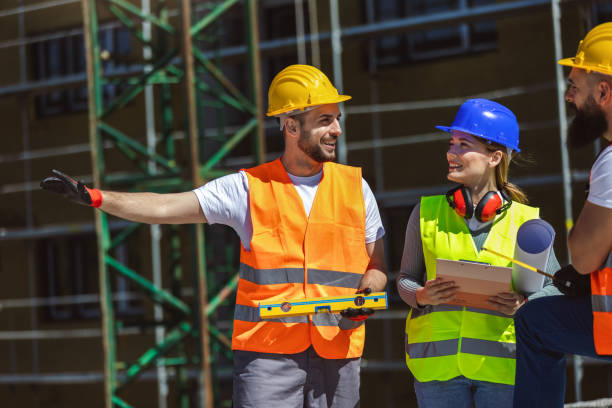 istock Construction team planning a building blueprint project on site with collaboration for architect innovation. 2148991031