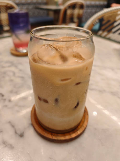 Iced Caffee Latte on Marble Table with Elegant Cafe Ambiance